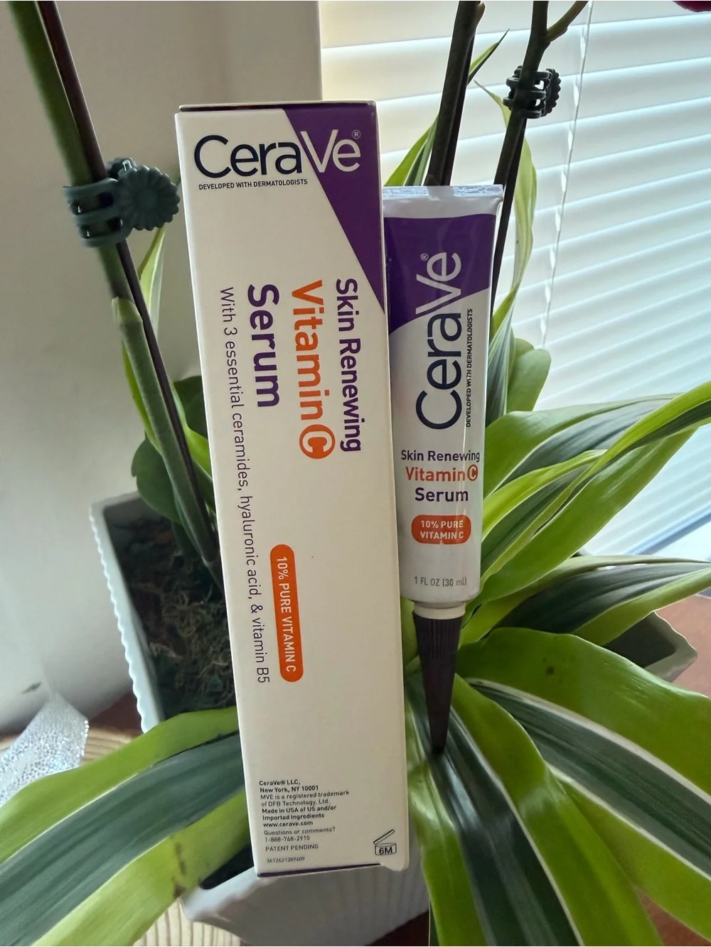 rave Vitamin C Serum Tube and Box in White and Purple